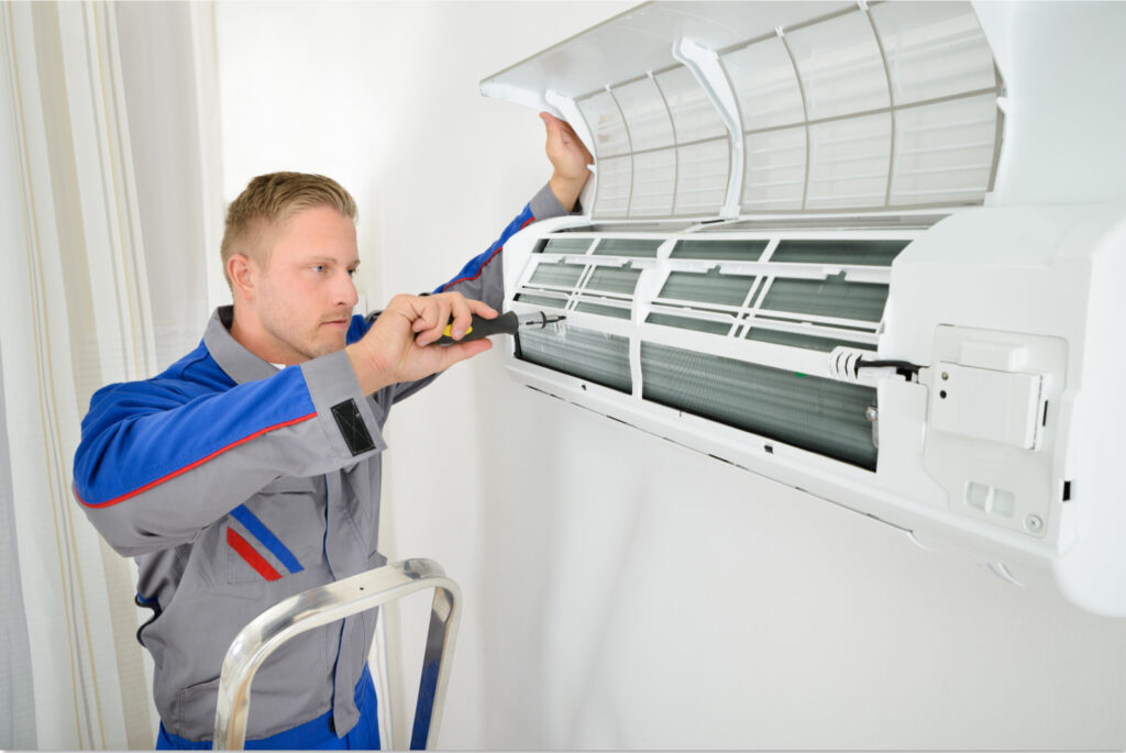 technician installing an ac