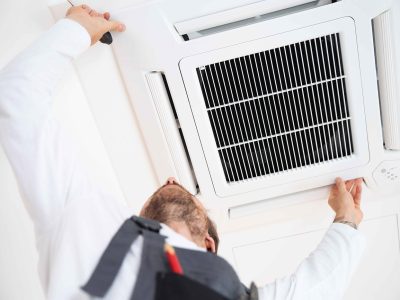 technician installing a commercial ac